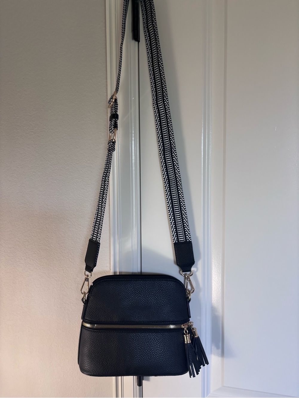 Textured Black Crossbody Bag with Patterned Strap